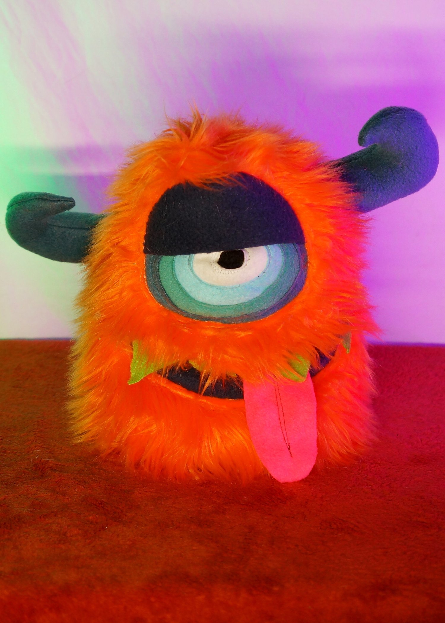 MEDIUM ORANGE ONE EYED MONSTER WITH HORNS & POCKET MOUTH — TIM